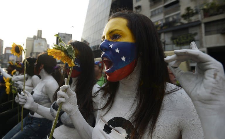 Students hold a demonstration in front of government offices in Caracas on March 4, 2013 demanding the government reveal more about the health of cancer-stricken President Hugo Chavez. Information Minister Ernesto Villegas said Monday Chavez was suffering from a "new and severe" infection that has worsened his breathing