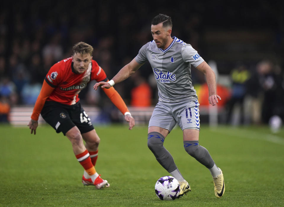 Luton Town's Alfie Doughty, left, and Everton's Jack Harrison in action during the English Premier League soccer match between Luton Town and Everton at Kenilworth Road, Luton, Friday May 3, 2024. (Bradley Collyer/PA via AP)