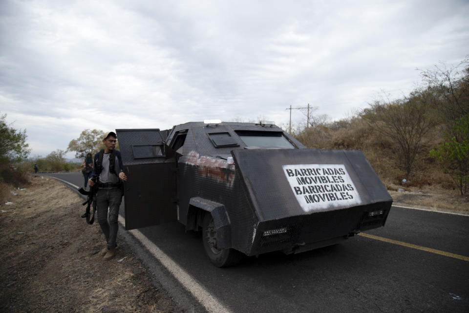 The Spanish message "Mobile barricade" covers the front of a homemade tank known as a "monster" during patrols by a female-led, self-defense group along the edge of El Terrero, where it shares a border with the town of Aguililla, in Michoacan state, Mexico, Thursday, Jan. 14, 2021. The rural area is traversed by dirt roads, through which they fear Jalisco gunmen could penetrate at a time when the homicide rate in Michoacán has spiked to levels not seen since 2013. (AP Photo/Armando Solis)