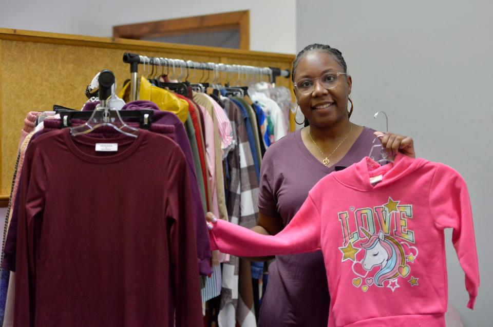 Naticia Thorpe-Reid holds one of the clothing items available for children at her MiniMe Clothing Boutique on Plant Road in Hyannis. She will be among the vendors at Amplify Cape Cod's Holiday Vendors Market on Dec. 10 that will showcase businesses owned by people of color.