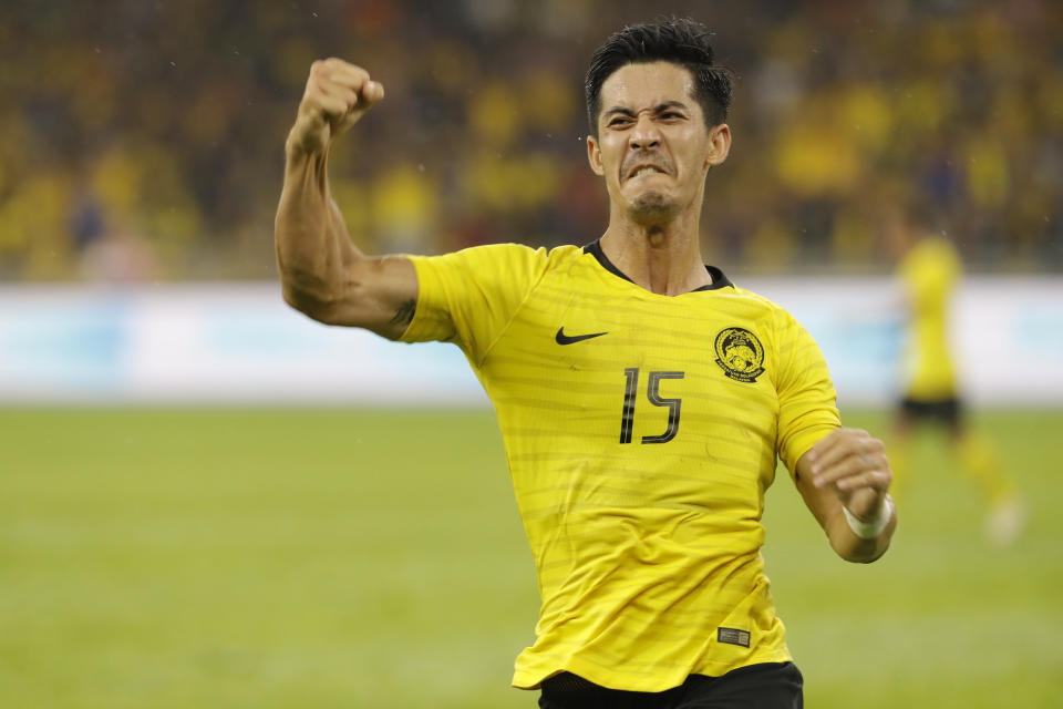 Brendan Gan of Malaysia celebrate after scored during World Cup Asia qualifying match between Malaysia and Thailand at Bukit Jail Stadium in Kuala Lumpur, Thursday, Nov. 14, 2019. (AP Photo/Vincent Thian)