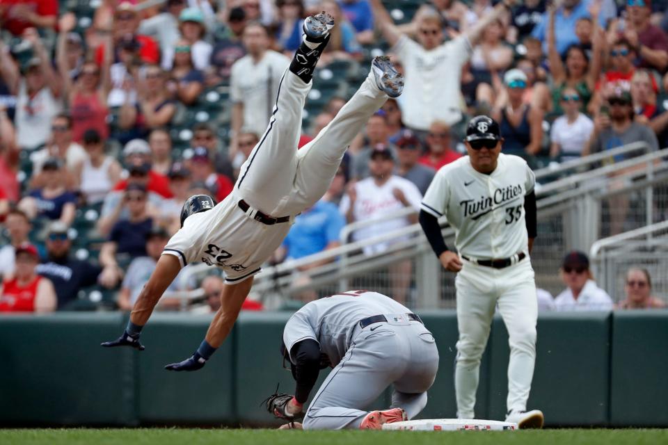 June 4: The Minnesota Twins' Royce Lewis (23) collides with and flies over Cleveland Guardians first baseman Gabriel Arias (13) on a ground out in the eighth inning at Target Field. The Guardians won 2-1.