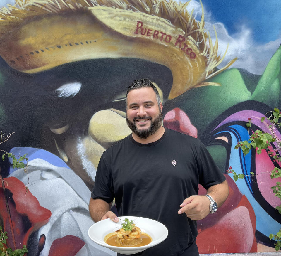 Chef Jose Mendin and his beloved mofongo con camarones al ajillo. (Courtesy of La Placita)