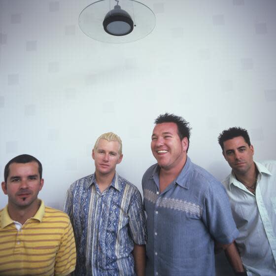 The members of alt-rock band Smash Mouth pose together