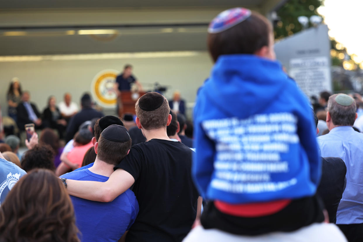 People, some wearing yarmulkes, at a rally in 2021 denouncing antisemitic violence.