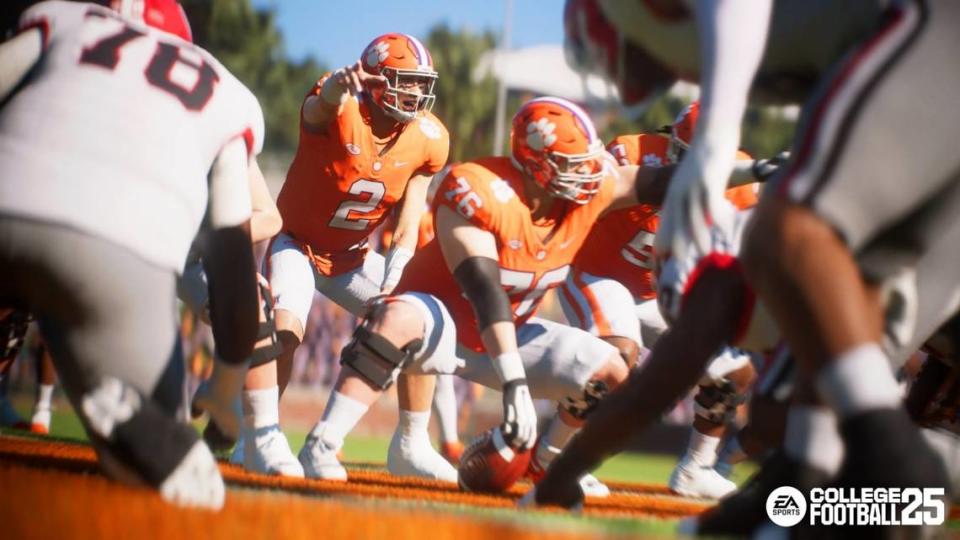 A virtual version of Clemson football quarterback Cade Klubnik (2) takes a snap from under center at Memorial Stadium in a College Football 25 gameplay shot released by EA Sports earlier this spring.