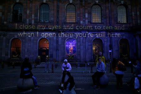 Words are projected onto St Ann's Church during the first anniversary of the Manchester Arena bombing, in Manchester, Britain, May 22, 2018. REUTERS/Andrew Yates