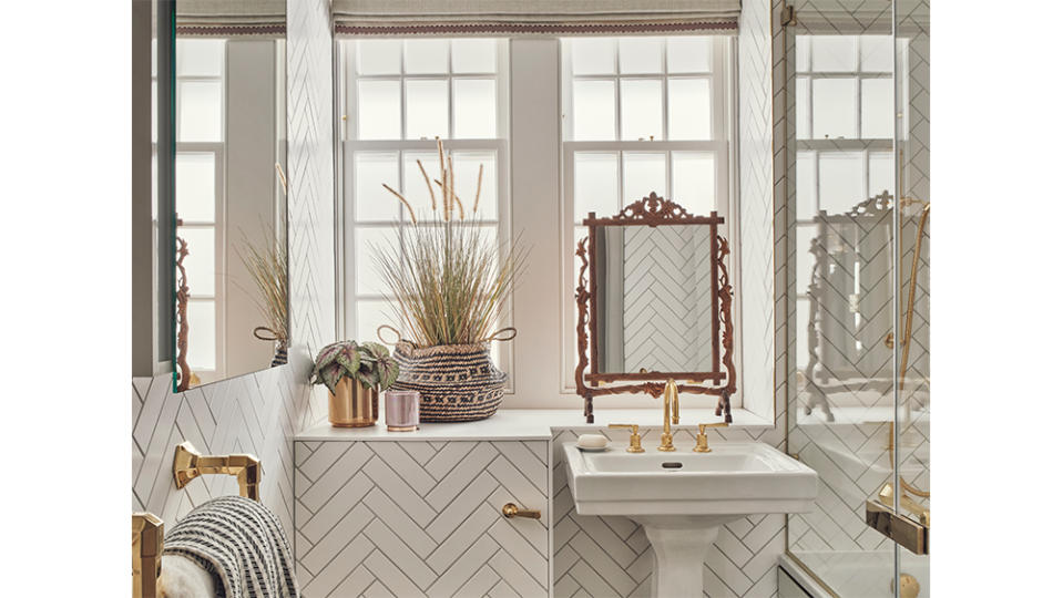 A bathroom filled with antique gold fixtures - Credit: Studio Rochowski