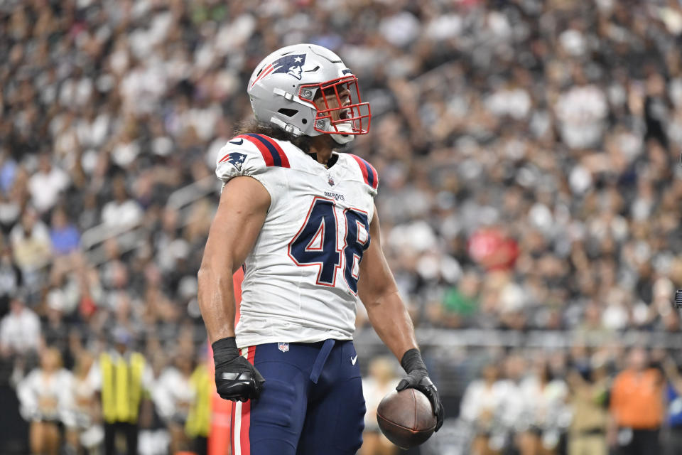 New England Patriots linebacker Jahlani Tavai celebrates his interception during the first half of an NFL football game against the Las Vegas Raiders, Sunday, Oct. 15, 2023, in Las Vegas. (AP Photo/David Becker)