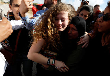 Palestinian teenager Ahed Tamimi is welcomed by relatives and supporters after she was released from an Israeli prison, at Nabi Saleh village in the occupied West Bank July 29, 2018. REUTERS/Mohamad Torokman