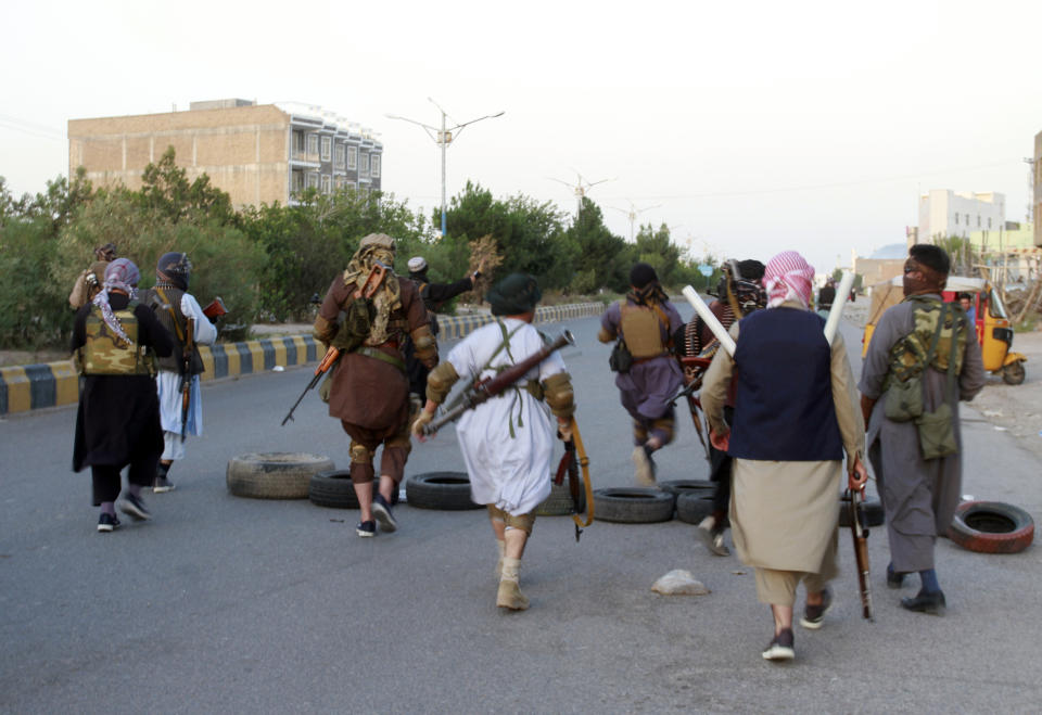 Private militia loyal to Ismail Khan, the former Mujahideen commander, patrols after security forces took back control of parts of Herat city following fighting between Taliban and Afghan security forces in Herat province, west of Kabul, Afghanistan, Friday, Aug. 6, 2021. (AP Photo/Hamed Sarfarazi)