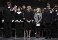 Ontario Premier Kathleen Wynne (C) attends the public memorial for police constable John Zivcic in Toronto December 9, 2013. Zivcic died December 2, from injuries he sustained in a car crash while in pursuit of another vehicle. He was Toronto's 26th officer to die while on duty since the Toronto police force began in 1957. REUTERS/Mark Blinch/Pool (CANADA - Tags: OBITUARY POLITICS)