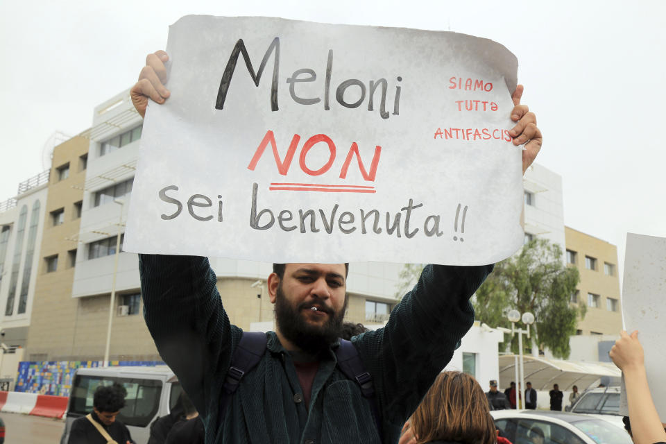 Activists demonstrate outside the delegation of the European Union to Tunisia against migrant deals with EU, in the capital Tunis, Thursday, May 9, 2024. Tensions in Tunisia are ratcheting up as authorities increasingly targeting migrants communities from the country's shoreline to its capital, where protestors staged a sit-in in front of European Union headquarters on Thursday. Banner reads "Meloni is not welcome." (AP Photo/Anis Mili)