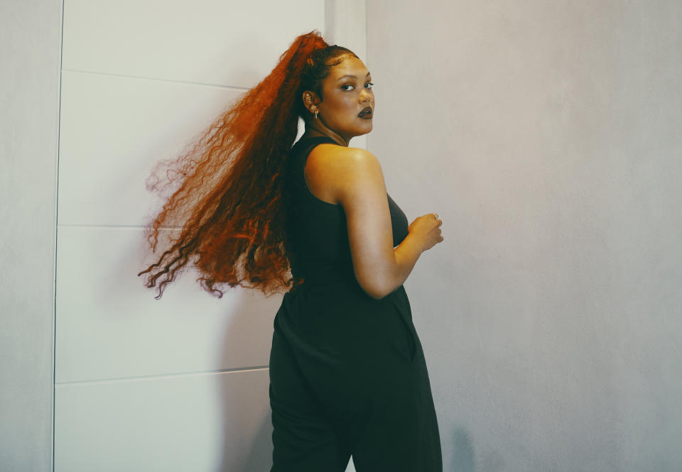 Shot of a fashionable young woman posing indoors (Photo: Delmaine Donson via Getty Images)