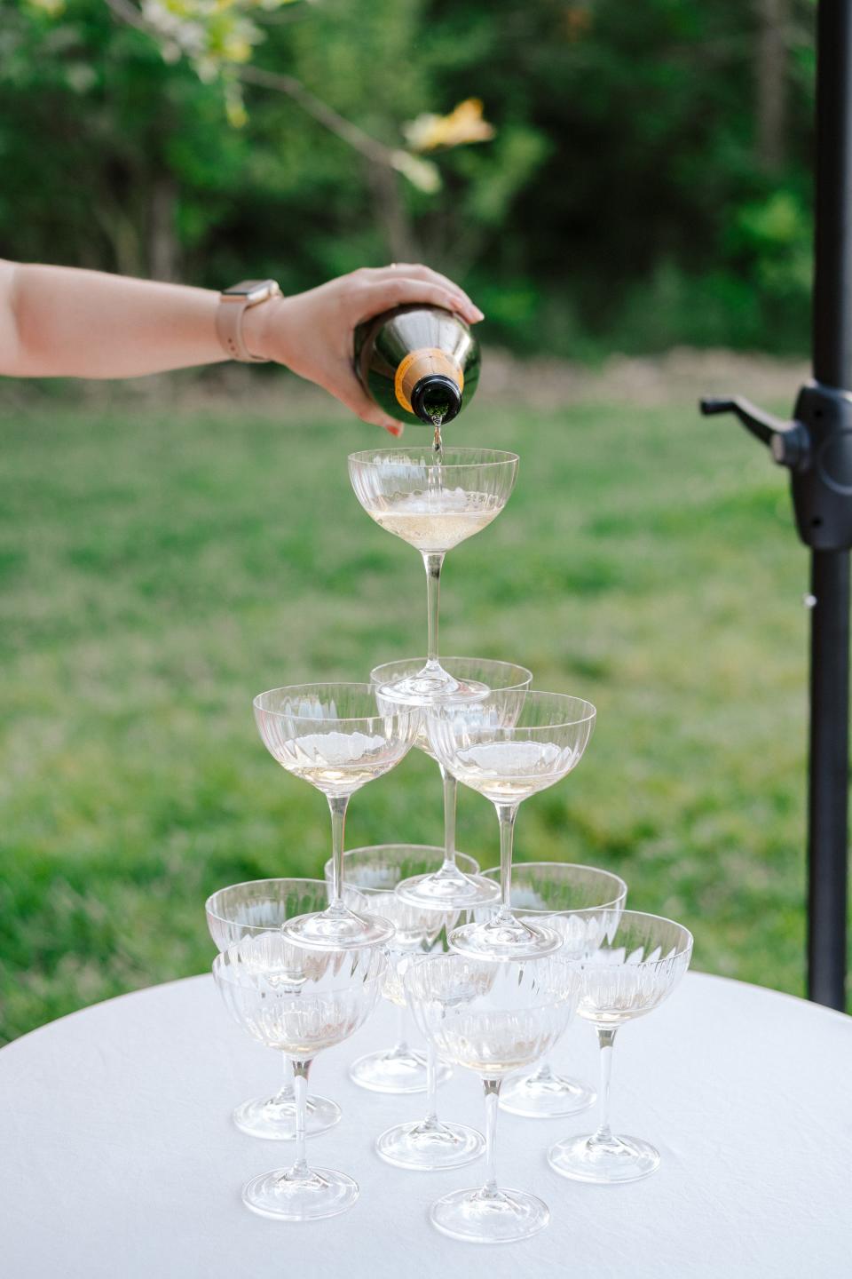 Steady hands for the Champagne tower pour.