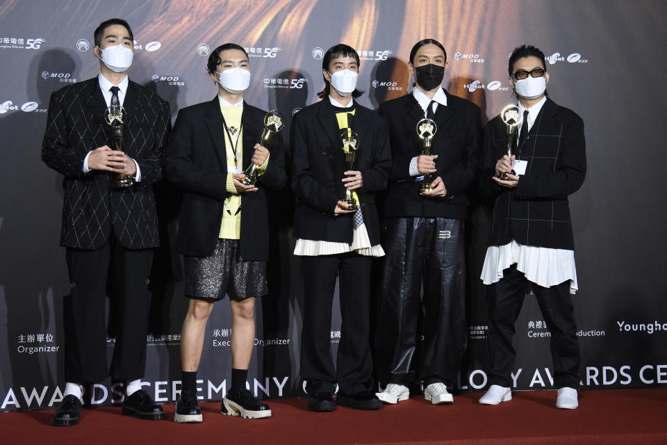 TAIPEI, CHINA - AUGUST 21: Members of Taiwanese band Sunset Rollercoaster pose with trophies backstage during the 32nd Golden Melody Awards on August 21, 2021 in Taipei, Taiwan of China. (Photo by Chen Lihong/VCG via Getty Images)