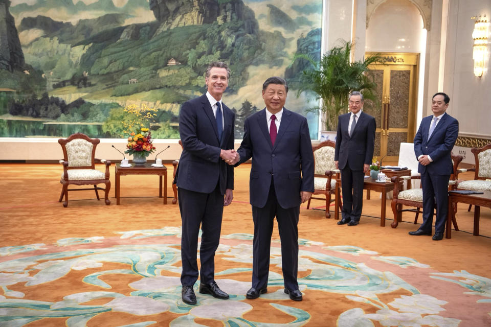 In this photo taken Wednesday, Oct. 25, 2023 and released by Office of the Governor of California, California Gov. Gavin Newsom, left, meets with Chinese President Xi Jinping at the Great Hall of the People in Beijing. (Office of the Governor of California via AP)