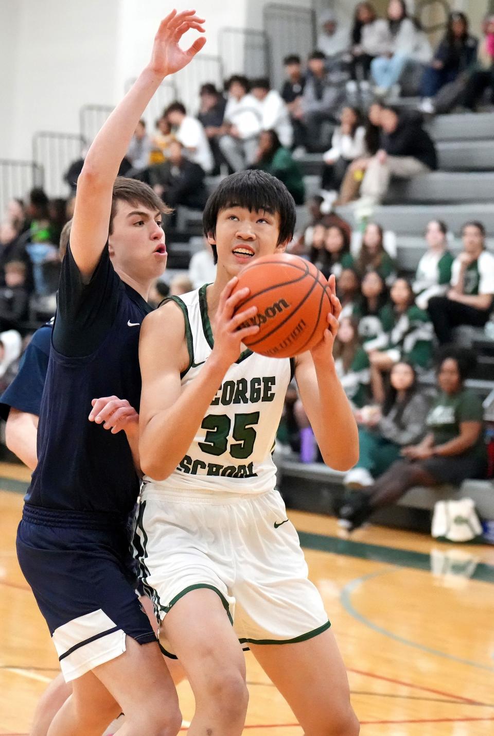 George School freshman Ziyi Xiong from China drives to the basket against Germantown Friends on Jan. 30.