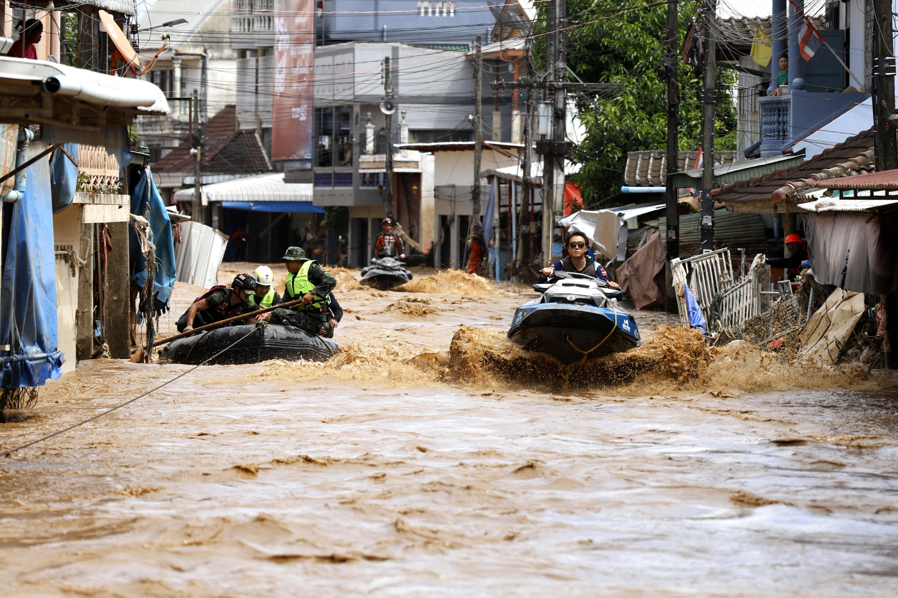 A rescue worker uses jet skis to search for victims in flooded areas in Chiang Rai province, Thailand, Friday, Sept. 13, 2024. (Sarot Meksophawannakul/AP)