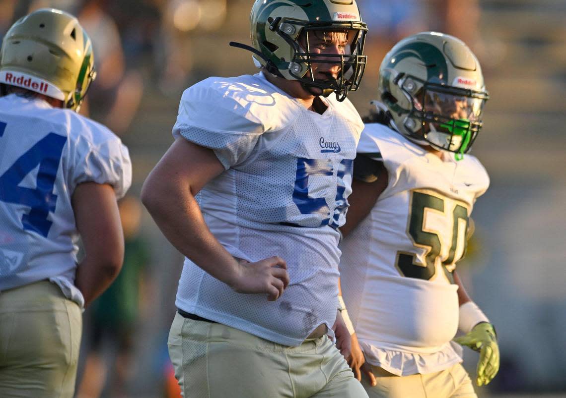 Garces High offensive linemen wear a mix of green or blue numbers on jerseys in the game against Clovis Thursday, Aug. 17, 2023 in Clovis. Shipment of new Garces jerseys for the season were missing the new offensive line jerseys. ERIC PAUL ZAMORA/ezamora@fresnobee.com
