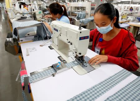 Labourers work at TAL garment factory in Vinh Phuc province, Vietnam May 23, 2017. Picture taken May 23, 2017. REUTERS/Kham