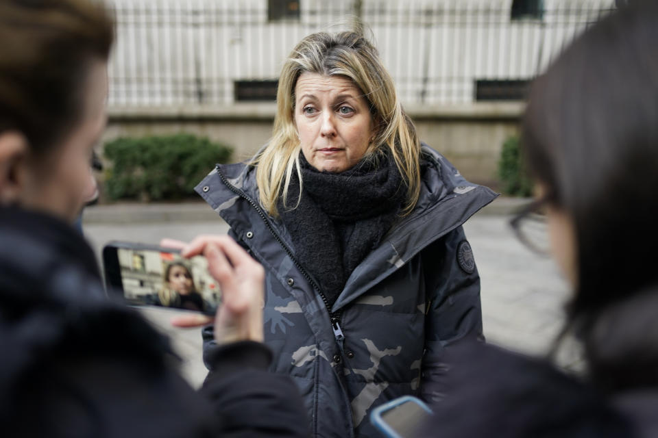 Laurie Kanyok, a former patient of Dr. Robert Hadden, speaks to reporters following Hadden's conviction in federal court in New York, Tuesday, Jan. 24, 2023. Hadden, a gynecologist who molested patients during a decades long career, was convicted of federal sex trafficking charges Tuesday, after nine former patients told a New York jury how the doctor they once trusted attacked them sexually when they were most vulnerable. (AP Photo/Seth Wenig)