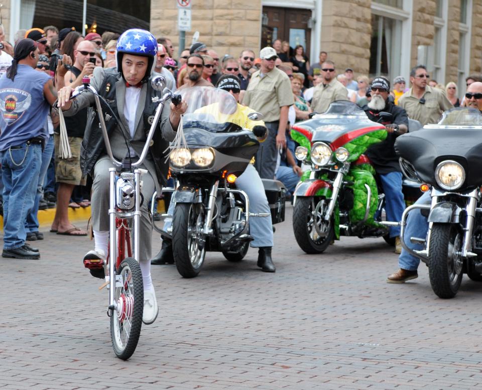 Paul Ruebens, in character as Pee-wee Herman, leads 300 bikers out of Deadwood, S.D. on Monday, Aug. 9, 2010, on the 3rd Annual Legends Ride charity event during the 70th Annual Sturgis Motorcycle Rally