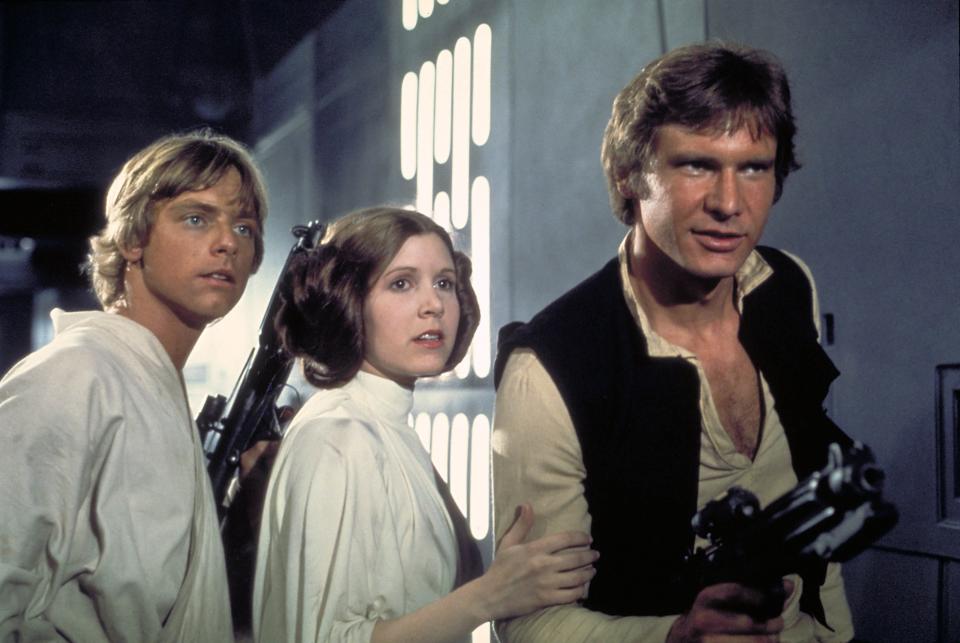 The core trio in the 'Star Wars' saga: Mark Hamill (as Luke Skywalker), Carrie Fisher (as Princess Leia Organa) and Harrison Ford (as Han Solo) in 'A New Hope.'