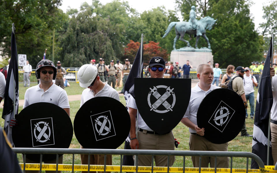 White supremacists, holding shields with a symbol of Vanguard America on them, gather under a statue of Robert E. Lee during a rally in Charlottesville, Virginia, U.S., August 12, 2017. (Photo: Joshua Roberts / Reuters)