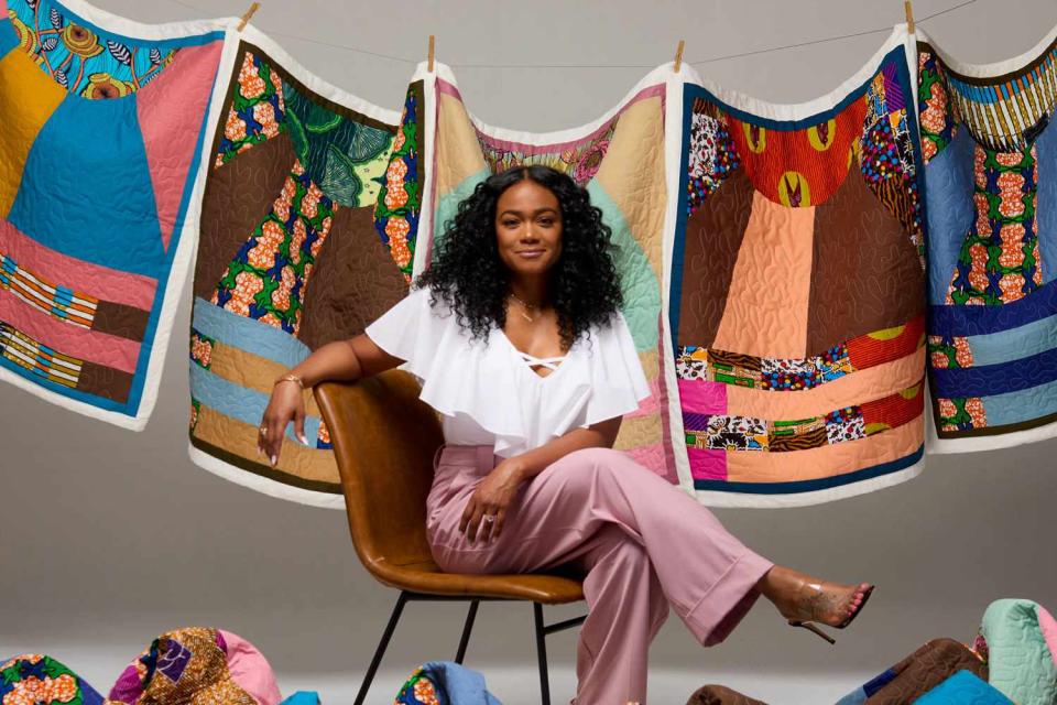 <p>Trokon</p> Tatyana Ali with Baby Yams quilts