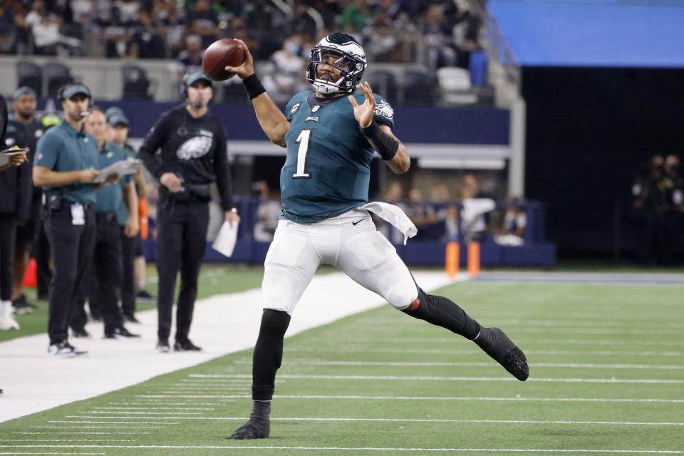 Philadelphia Eagles quarterback Jalen Hurts (1) throws a pass late in the second half of an NFL football game against the Dallas Cowboys in Arlington, Texas, Monday, Sept. 27, 2021. (AP Photo/Michael Ainsworth)