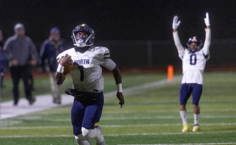 Toms River North junior quarterback Micah Ford (No. 1 ) is shown scoring the first of his five TDs in the Mariners' 42-14 win over Edison in a NJSIAA Group 5 semifinal on Nov. 19 as sophomore wide receiver Nasir Jackson raises his hands in celebration in the background.