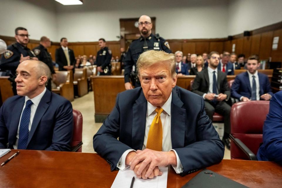 Former president Donald Trump sits at the defense table in Manhattan criminal court in New York City on May 21 2024 (via REUTERS)