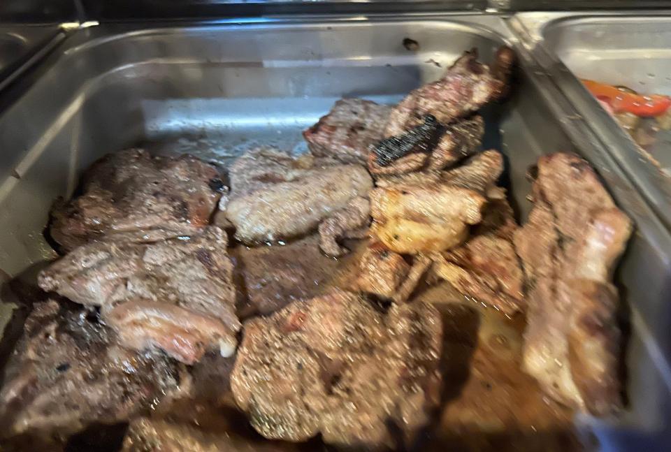 Cut pieces of New York strip steak sit in a chafer as part of the brunch selection at DP Jackson Steak, Chop and Seafood House in Jackson Township.