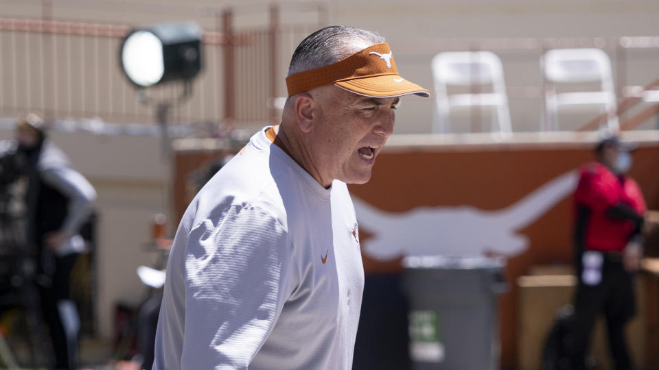 FILE - Texas offensive coordinator Kyle Flood works with the offensive line before the Texas Orange and White Spring Scrimmage in Austin, Texas, Saturday, April 24, 2021. Flood followed Texas head coach Steve Sarkisian from Alabama. (AP Photo/Michael Thomas, File)