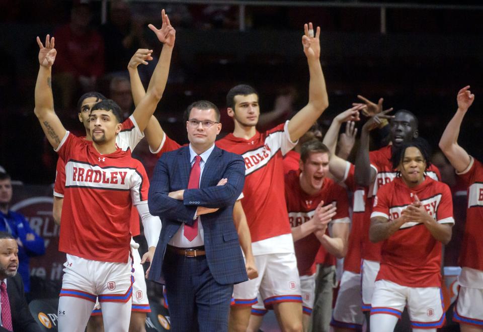 The Bradley bench celebrates a three-pointer early in the game against SIU on Wednesday, Feb. 1, 2023 at Carver Arena.