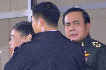 Thailand's army chief General Prayuth Chan-ocha (R) leaves the Army Club after a meeting with all rival factions in central Bangkok May 22, 2014. REUTERS/Stringer