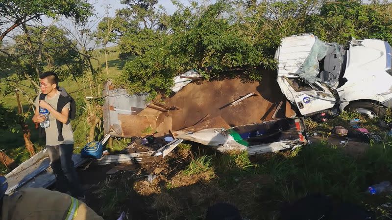 Migrant is seen following a crash on a highway in San Andres Tuxtla