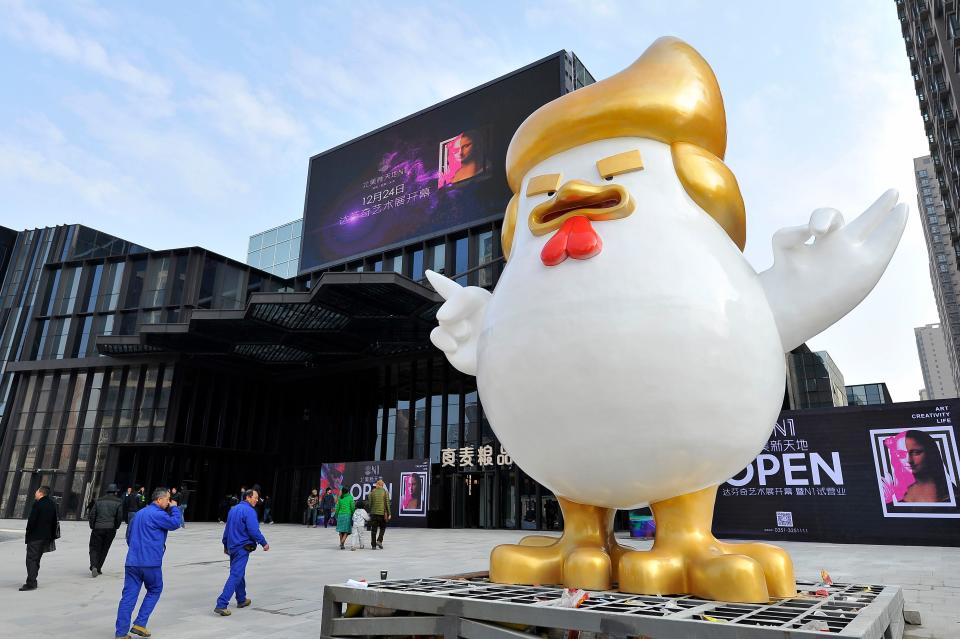 This photo taken on December 24, 2016 shows a giant chicken sculpture outside a shopping mall in Taiyuan, north China's Shanxi province. A Chinese shopping mall is ringing in the Year of the Rooster&nbsp;with a giant sculpture of a chicken that looks like US president-elect Donald Trump. Photo: STR/AFP/Getty Images