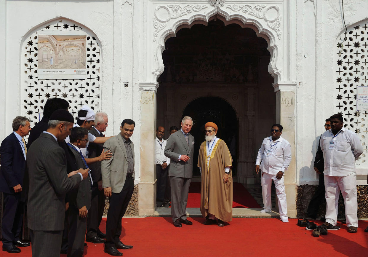 King Charles III, center left, stands with an Indian Muslim cleric at the Haji Ali Dargah in Mumbai, India