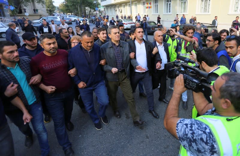 Opposition supporters hold a rally in Baku