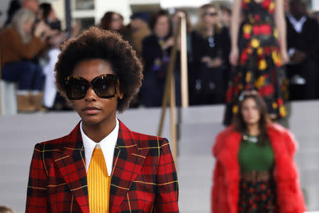 Models present creations from the Michael Kors 2018 fall collection during New York Fashion Week, in New York, U.S., February 14, 2018. REUTERS/Shannon Stapleton