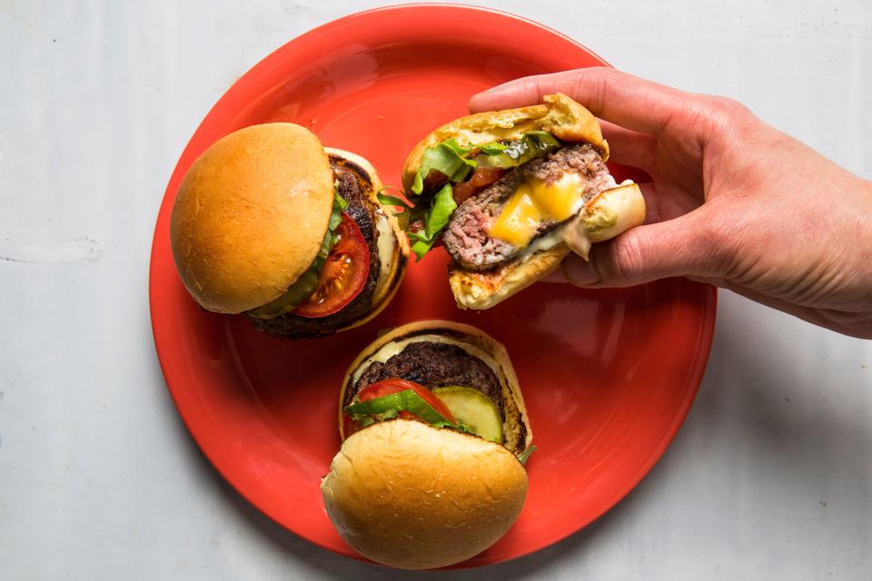 We’re obsessed with Juicy Lucys, cheese-filled burgers that originated in Minnesota. Here’s our recipe for sliders—appetizers that you can make super-decadent by melting some butter in the skillet before toasting the potato rolls. <a rel="nofollow noopener" href="https://www.bonappetit.com/recipe/juicy-lucy-sliders?mbid=synd_yahoo_rss" target="_blank" data-ylk="slk:See recipe.;elm:context_link;itc:0;sec:content-canvas" class="link ">See recipe.</a>