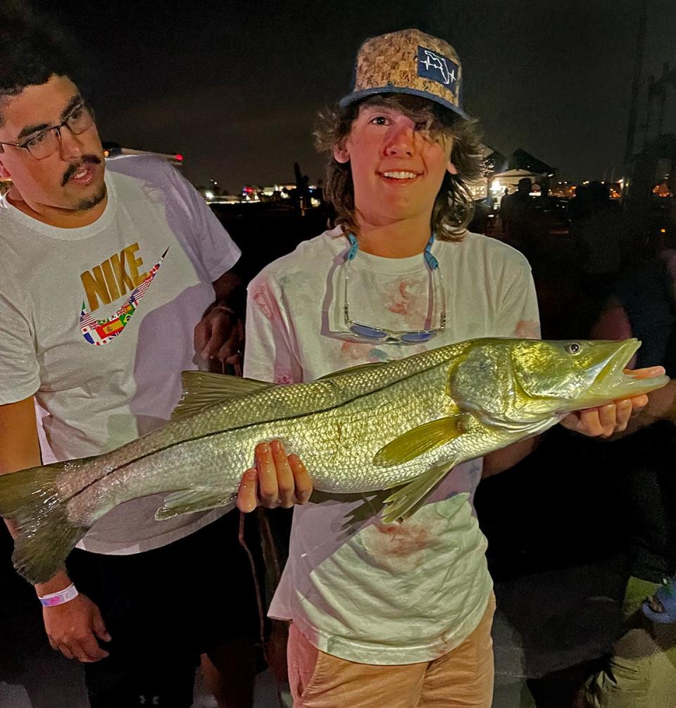 Carter Kruse, 15, of Ridgeville Corners, Ohio caught this 45-inch snook just after sunset while fishing at Big Pier 60 Wednesday night.