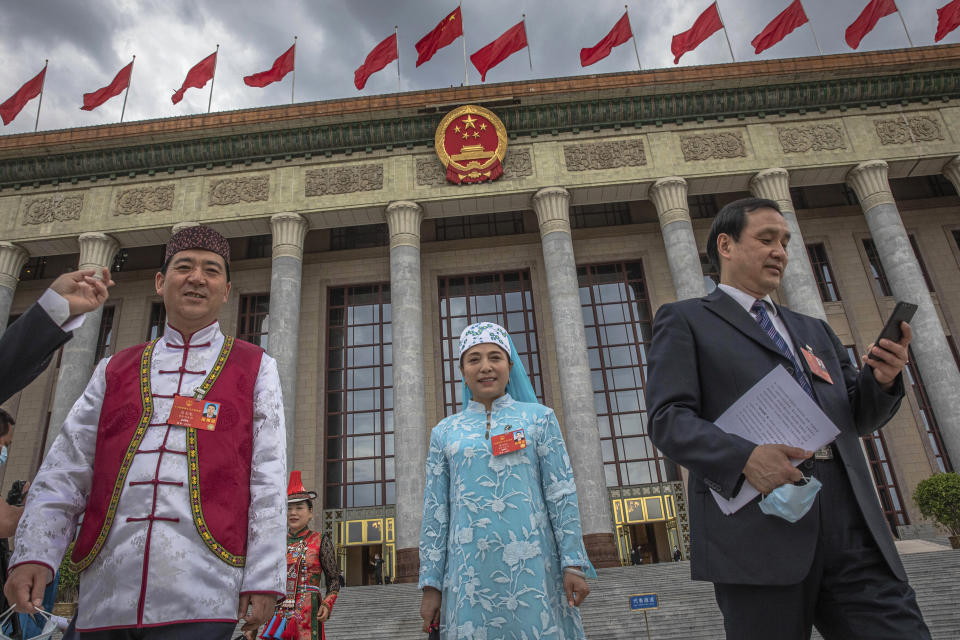 Delegates leave after the second plenary session of China's National People's Congress (NPC) at the Great Hall of the People in Beijing, Monday, May 25, 2020. (Roman Pilipey/Pool Photo via AP)