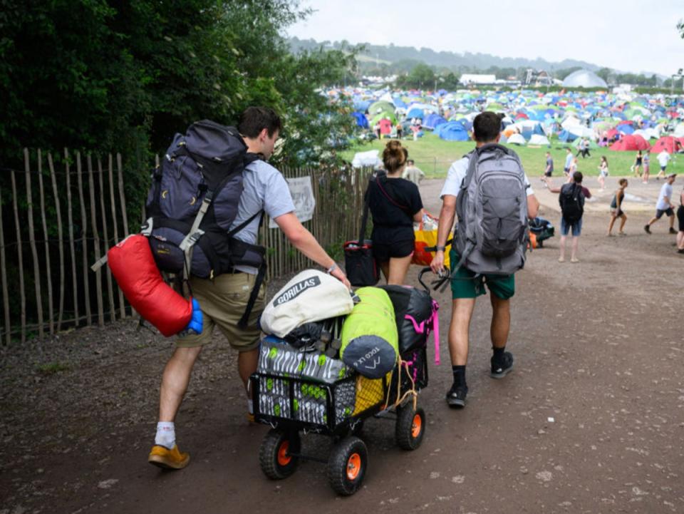 The first attendees pile into Glastonbury Festival this week (Getty Images)