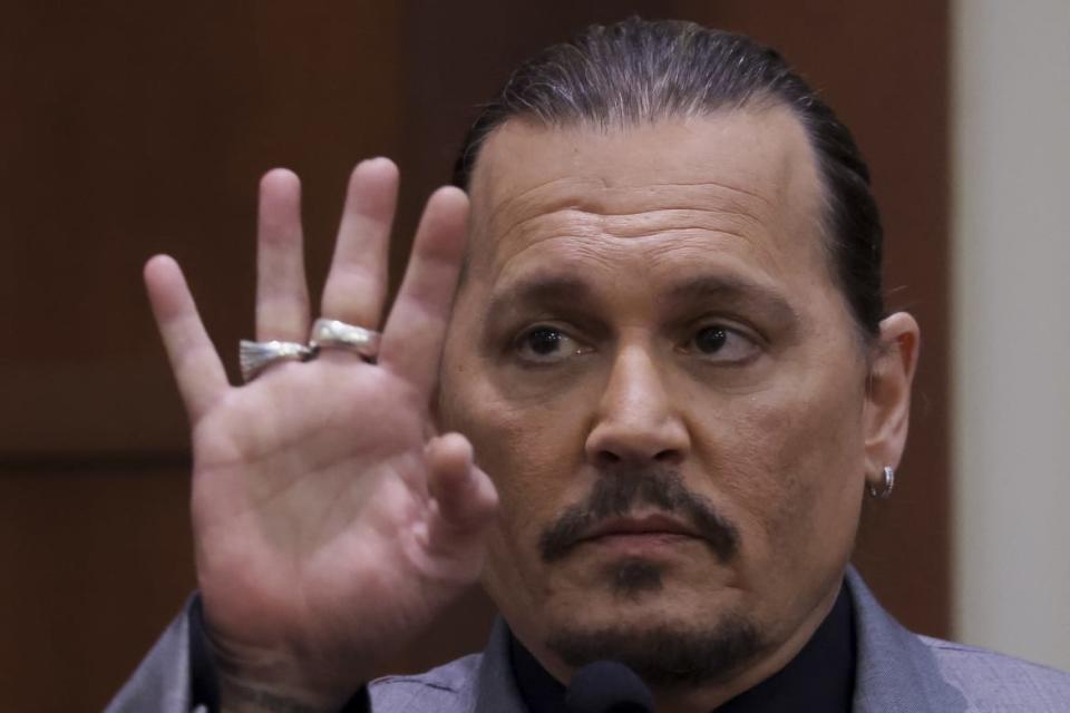 <div class="inline-image__caption"><p>Johnny Depp displays the middle finger of his hand, injured while he and his ex-wife Amber Heard were in Australia in 2015.</p></div> <div class="inline-image__credit">Evelyn Hockstein/AFP/Getty</div>