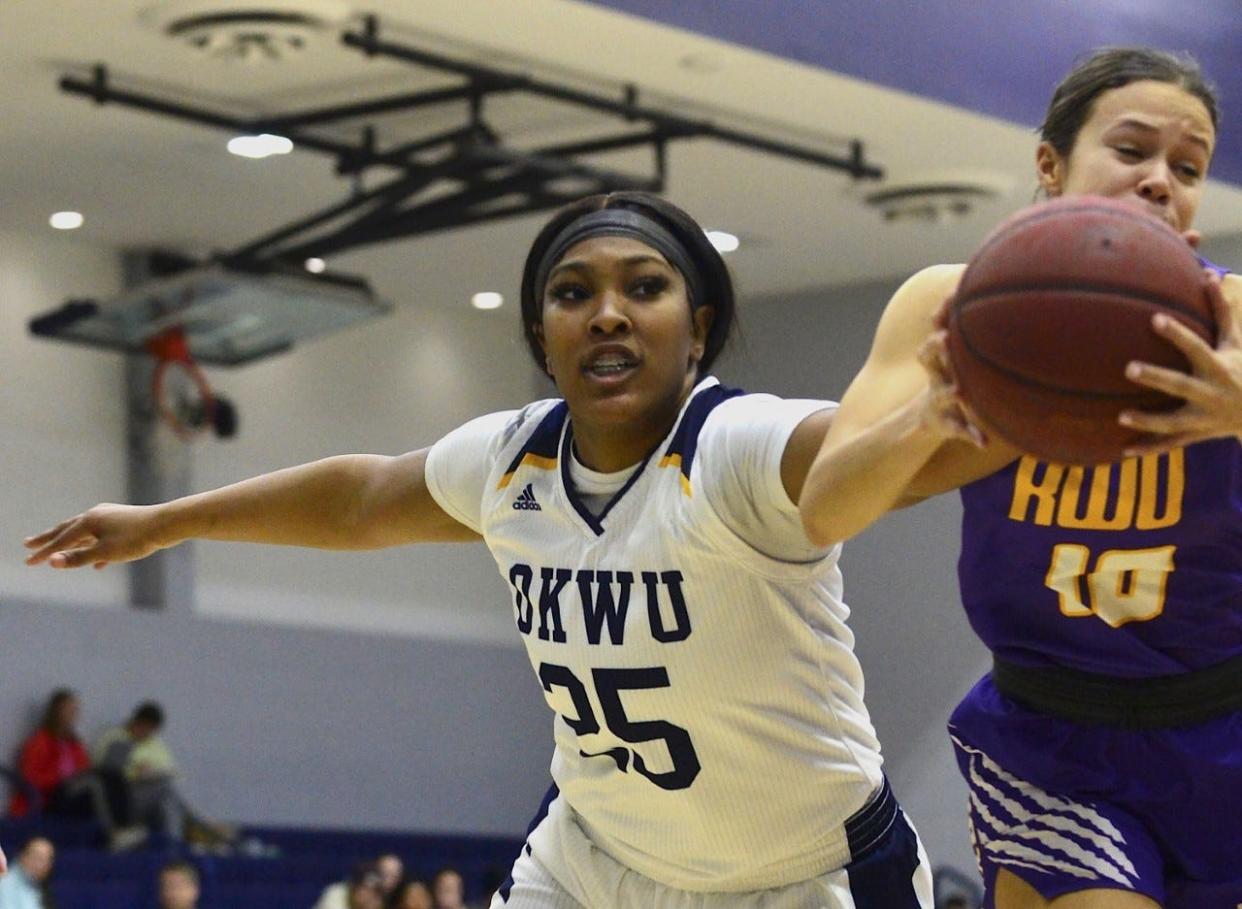 Oklahoma Wesleyan University's Jakeysia Fiemon, left, challenges a Kansas Wesleyan University player for the ball during women's basketball action Feb. 1, 2023, in Bartlesville.