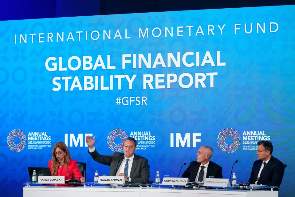 Tobias Adrian, second from left, monetary and capital markets department director at the International Monetary Fund, speaks at a news conference on the IMF's Global Financial Stability Report during the 2022 annual meeting of the IMF and the World Bank Group, Tuesday, Oct. 11, 2022, in Washington.
