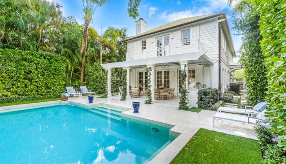 The two-story house at 449 Australian Ave. in Palm Beach has a poolside patio with a sundeck above it.